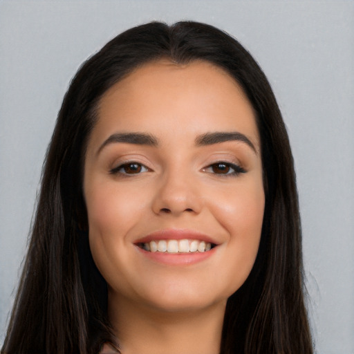 Joyful white young-adult female with long  black hair and brown eyes