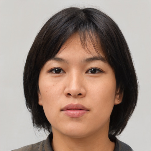 Neutral asian young-adult female with medium  brown hair and brown eyes