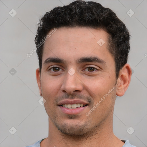 Joyful white young-adult male with short  black hair and brown eyes