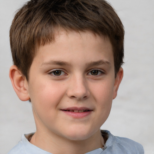 Joyful white child male with short  brown hair and brown eyes