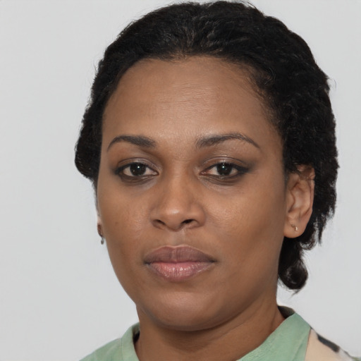 Neutral black young-adult female with short  brown hair and brown eyes