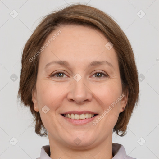 Joyful white adult female with medium  brown hair and grey eyes