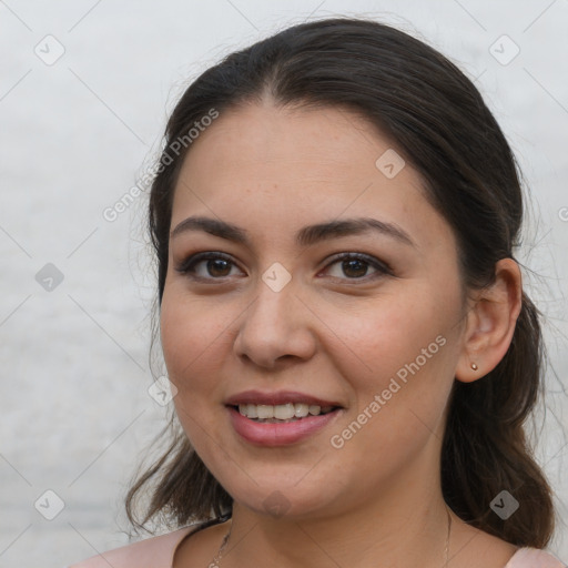 Joyful white young-adult female with long  brown hair and brown eyes