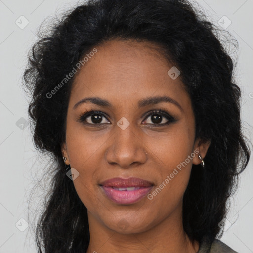 Joyful black young-adult female with long  brown hair and brown eyes