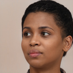 Joyful black young-adult female with short  black hair and brown eyes