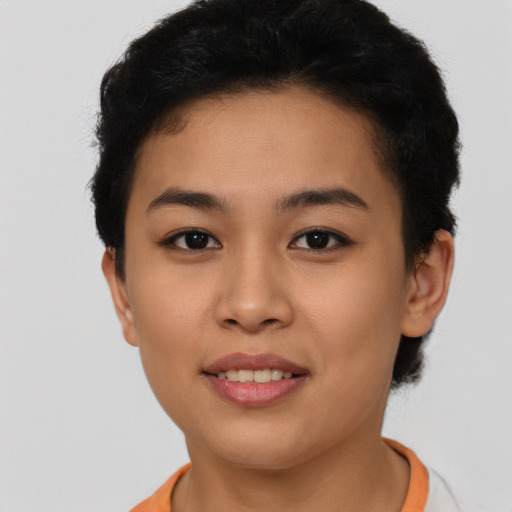 Joyful latino young-adult female with short  brown hair and brown eyes