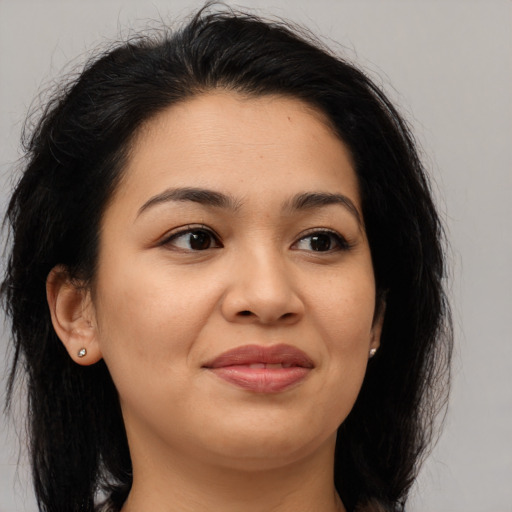 Joyful asian young-adult female with long  brown hair and brown eyes