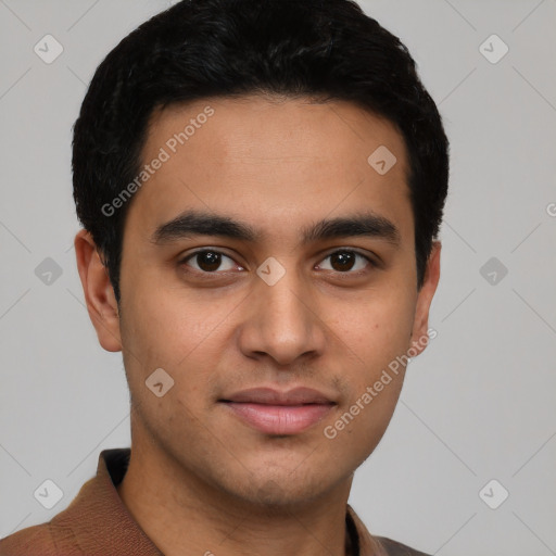 Joyful latino young-adult male with short  brown hair and brown eyes