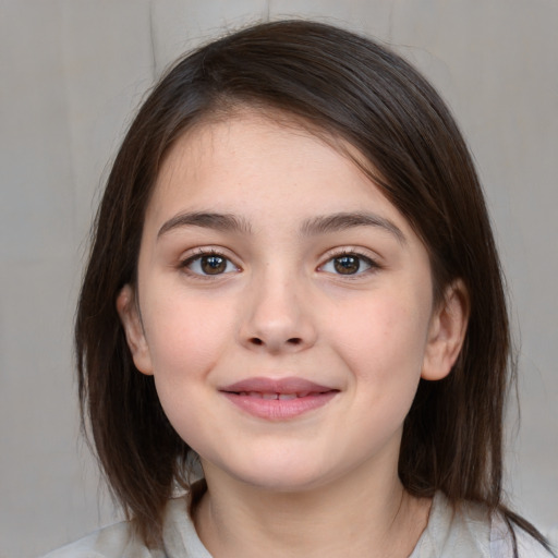 Joyful white child female with medium  brown hair and brown eyes