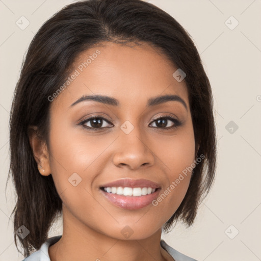 Joyful latino young-adult female with medium  brown hair and brown eyes