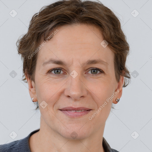 Joyful white adult female with short  brown hair and brown eyes