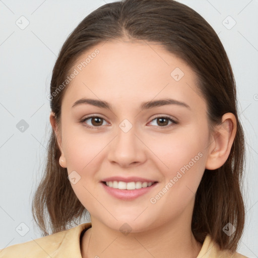 Joyful white young-adult female with medium  brown hair and brown eyes