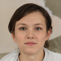 Neutral white young-adult female with short  brown hair and brown eyes