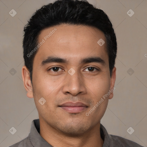 Joyful asian young-adult male with short  black hair and brown eyes