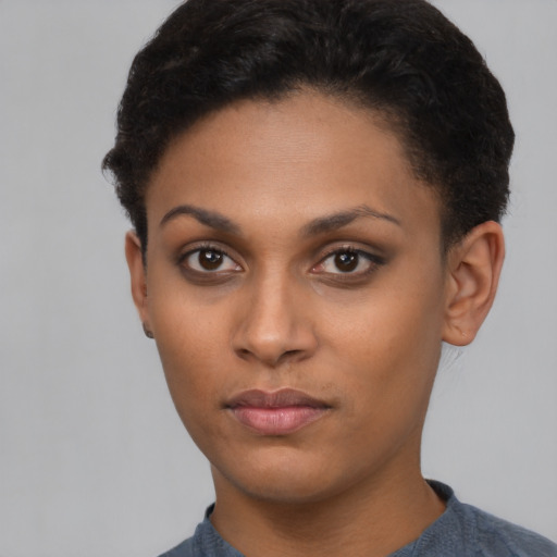 Neutral latino young-adult female with short  black hair and brown eyes