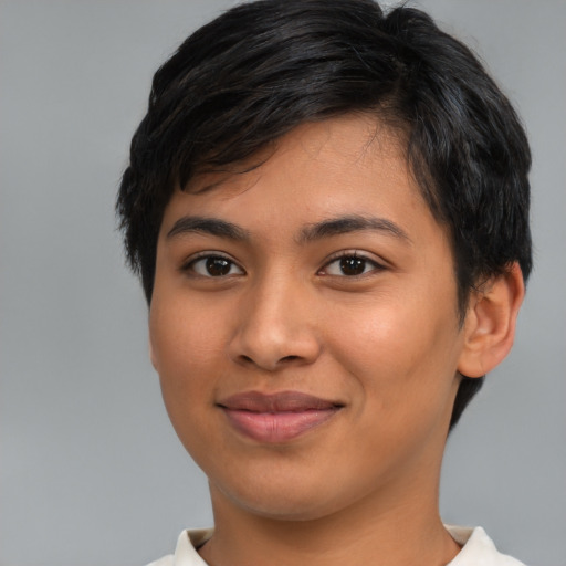 Joyful latino young-adult female with short  brown hair and brown eyes