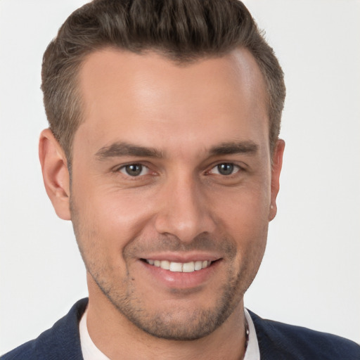 Joyful white young-adult male with short  brown hair and brown eyes