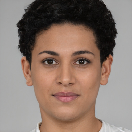Joyful latino young-adult female with short  brown hair and brown eyes