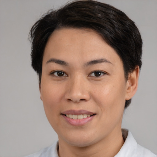 Joyful white adult female with medium  brown hair and brown eyes