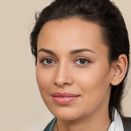 Joyful white young-adult female with long  brown hair and brown eyes