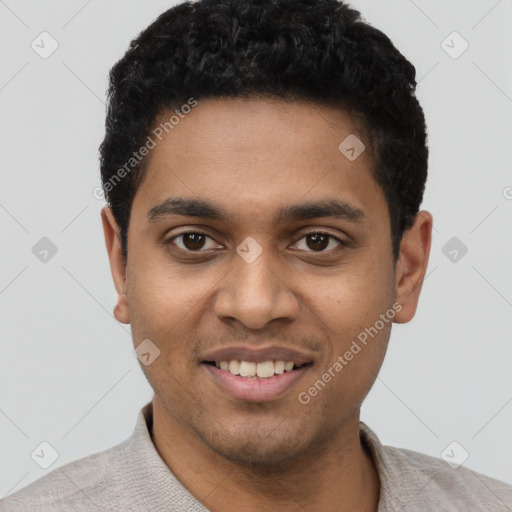 Joyful black young-adult male with short  black hair and brown eyes