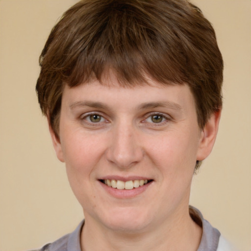 Joyful white young-adult female with short  brown hair and grey eyes