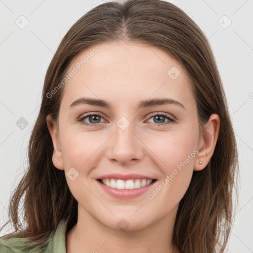 Joyful white young-adult female with long  brown hair and grey eyes