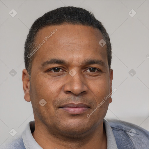 Joyful latino adult male with short  black hair and brown eyes