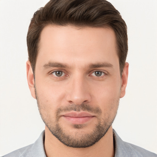 Joyful white young-adult male with short  brown hair and brown eyes