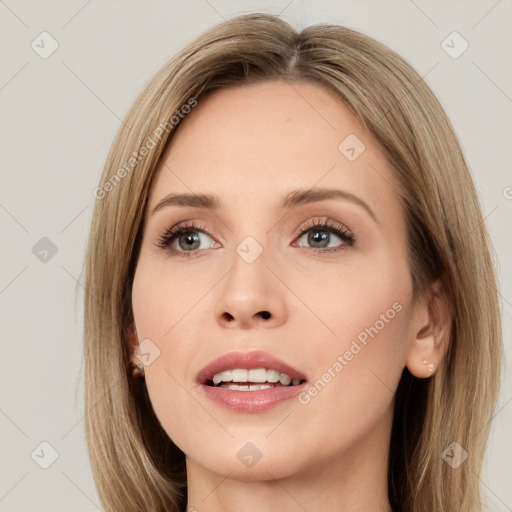 Joyful white young-adult female with long  brown hair and green eyes