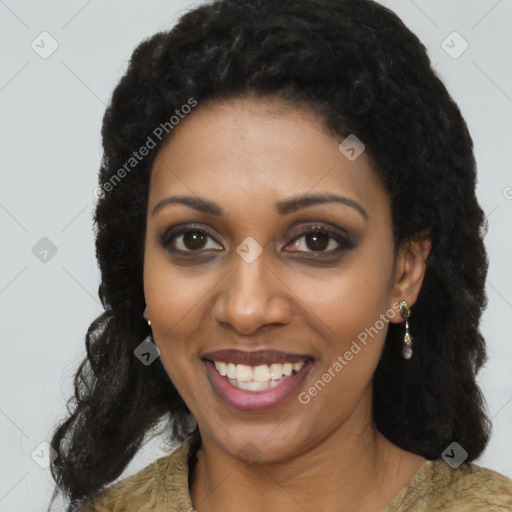 Joyful black young-adult female with long  brown hair and brown eyes