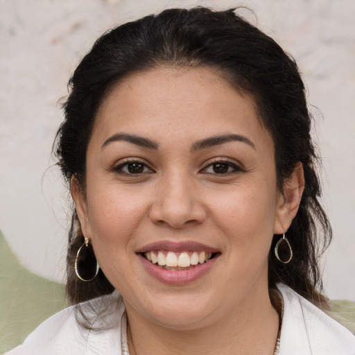 Joyful white young-adult female with medium  brown hair and brown eyes