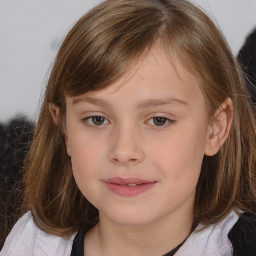 Joyful white child female with medium  brown hair and brown eyes