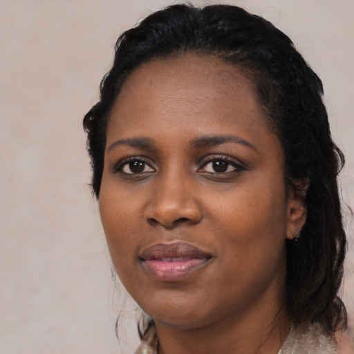 Joyful black young-adult female with medium  black hair and brown eyes