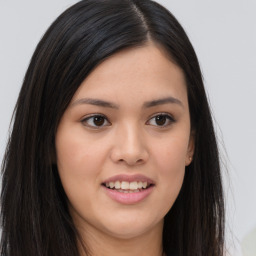 Joyful asian young-adult female with long  brown hair and brown eyes