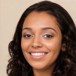 Joyful white young-adult female with long  black hair and brown eyes