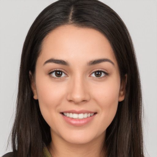 Joyful white young-adult female with long  brown hair and brown eyes