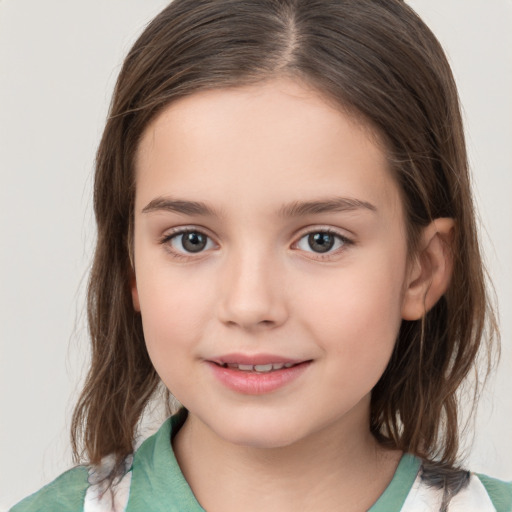 Joyful white child female with medium  brown hair and brown eyes