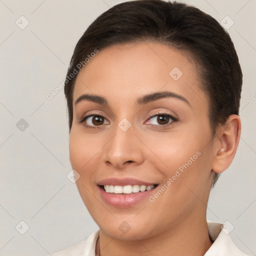 Joyful white young-adult female with short  brown hair and brown eyes