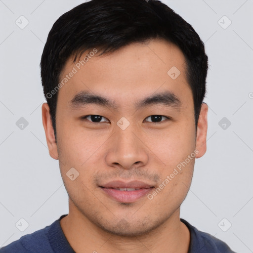 Joyful asian young-adult male with short  black hair and brown eyes