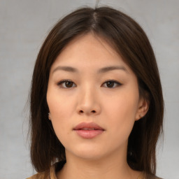 Neutral asian young-adult female with medium  brown hair and brown eyes