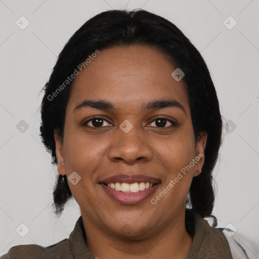 Joyful black young-adult female with short  black hair and brown eyes