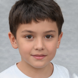 Joyful white child male with short  brown hair and brown eyes