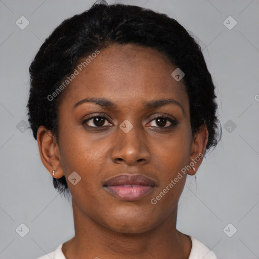 Joyful black young-adult female with short  black hair and brown eyes