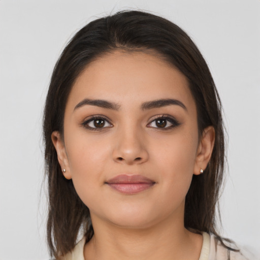 Neutral latino young-adult female with medium  brown hair and brown eyes