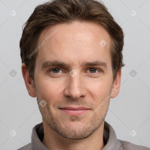 Joyful white adult male with short  brown hair and grey eyes