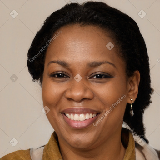 Joyful latino adult female with medium  brown hair and brown eyes