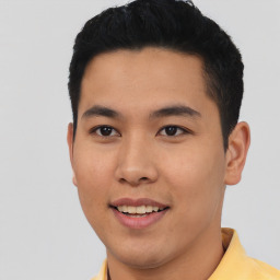 Joyful asian young-adult male with short  black hair and brown eyes