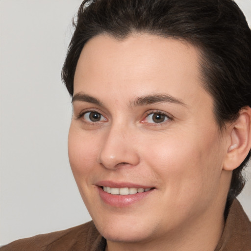 Joyful white young-adult female with medium  brown hair and brown eyes