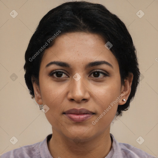 Joyful latino young-adult female with short  black hair and brown eyes